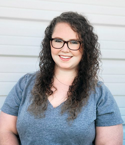 Woman with a great smile, and glasses