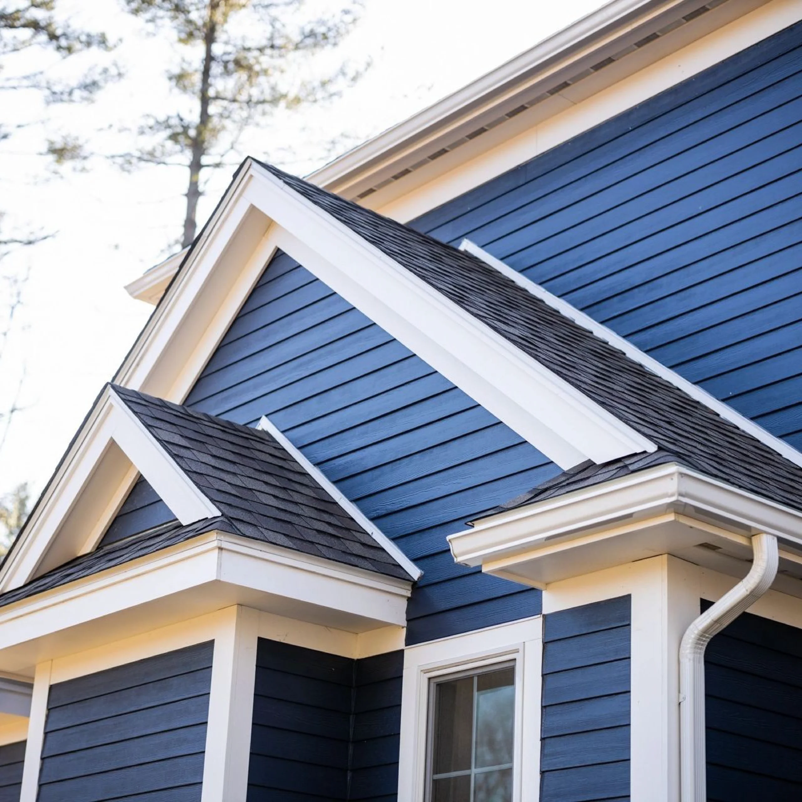 blue painted house siding with white trim