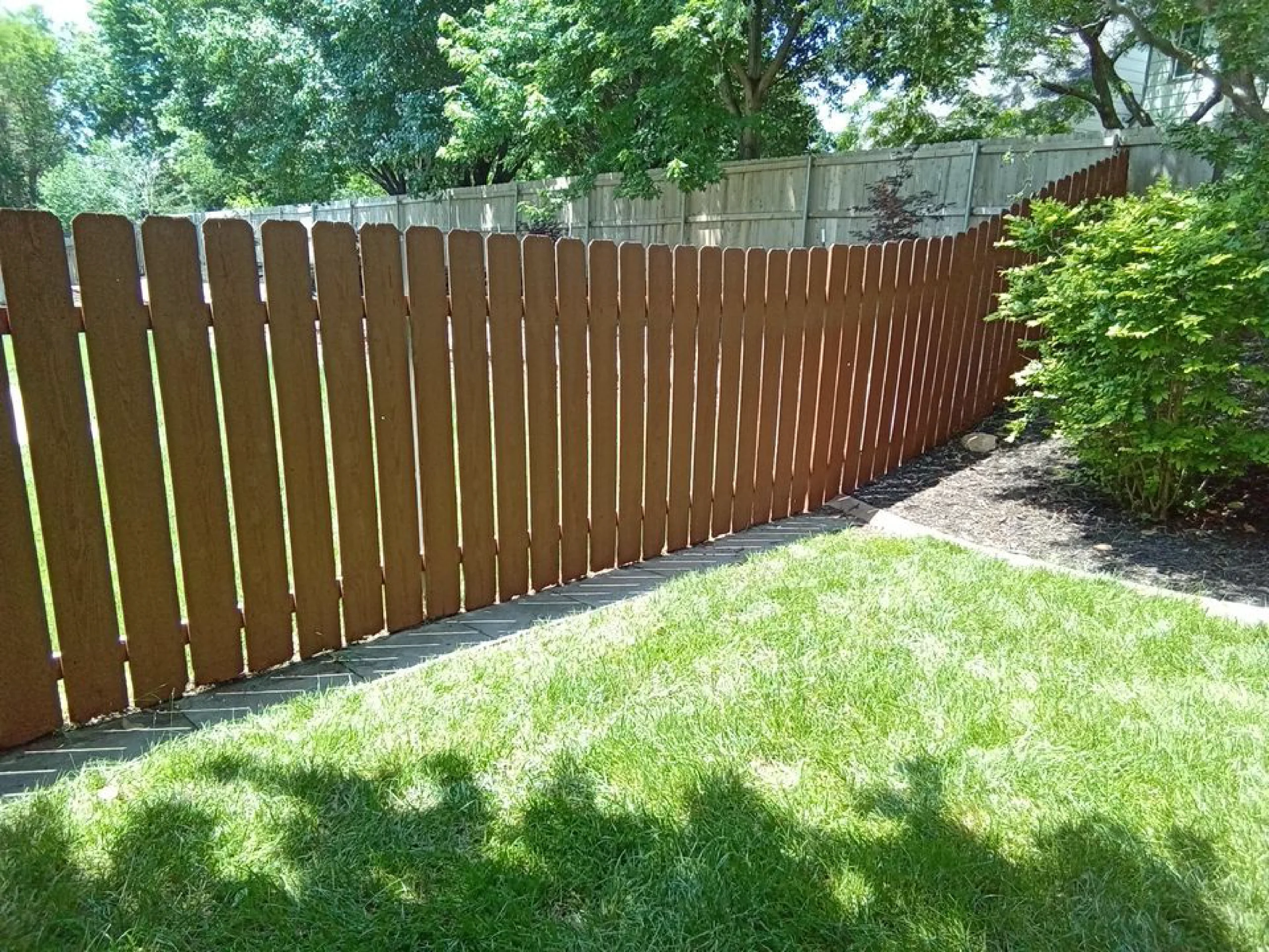 outdoor wood fence professionally refinished looks brand new