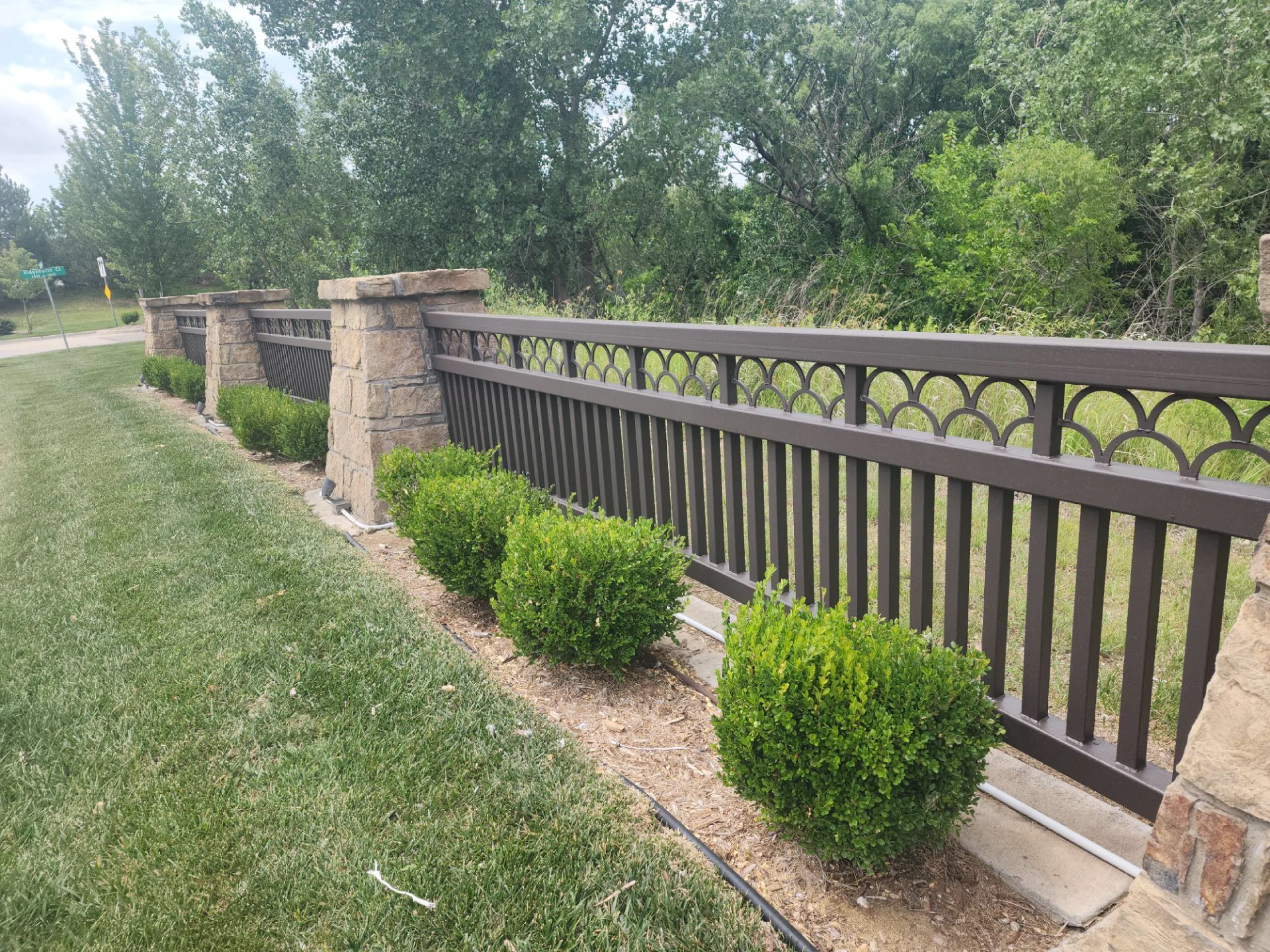 neighborhood home owners association fencing professionally painted with the best quality products to protect against weather, time, and the elements