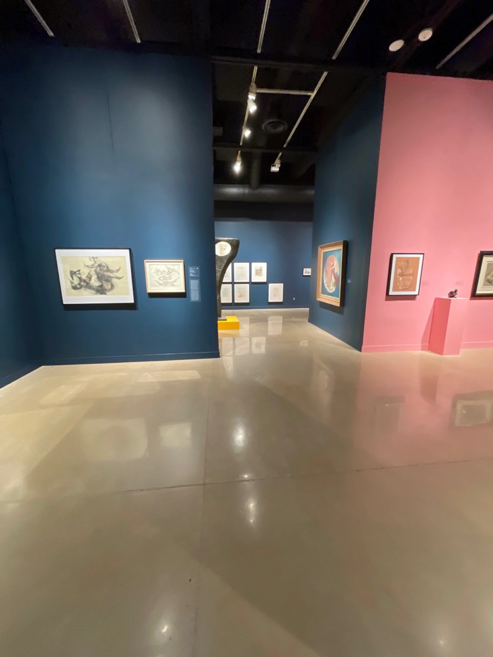 River City Painting has museum quality finishes seen here in this stunning teal and pink commercial interior, professionally painted for Wichita State University's, Ulrich Museum of Art
