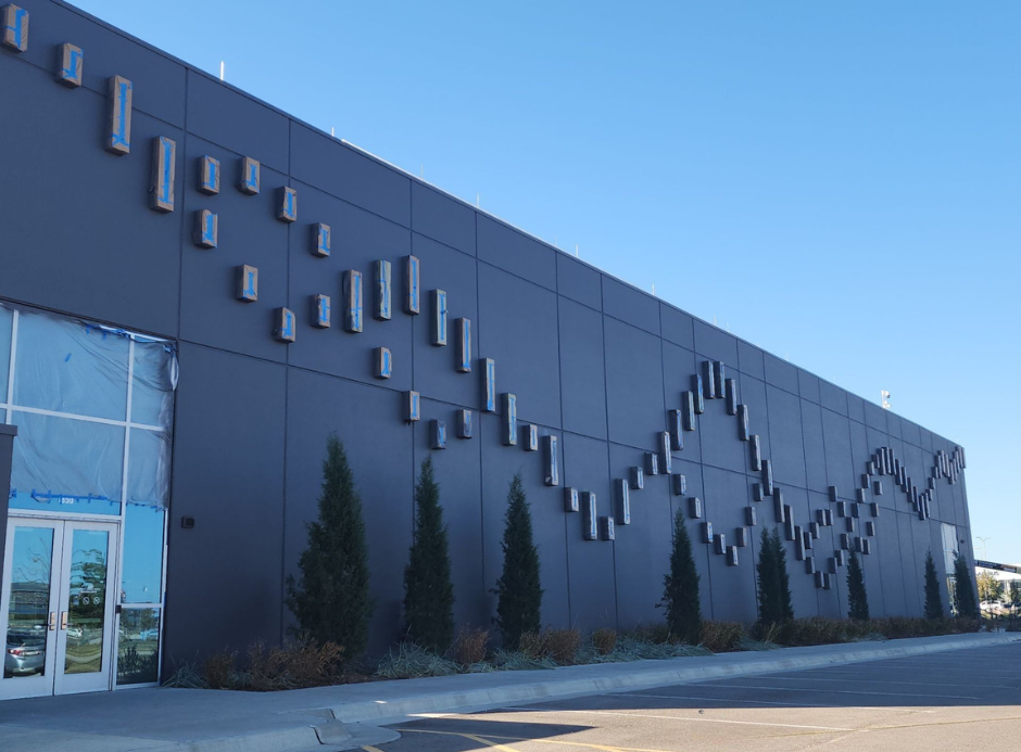 Exterior photo of a commercial property being painted in Wichita KS